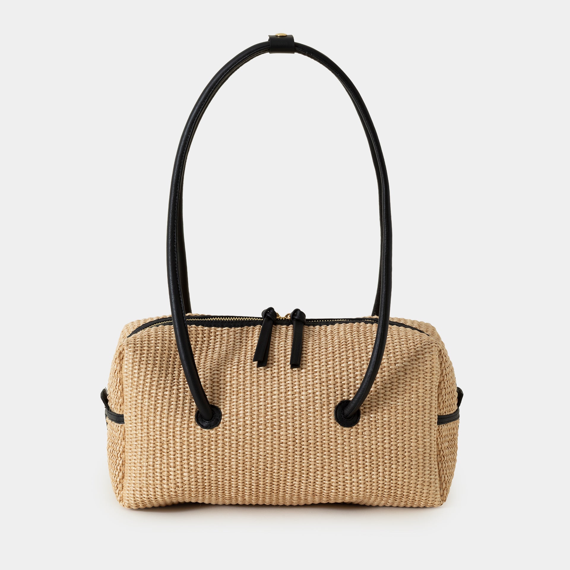 borsa Carol in rafia ecru e pelle nera del marchio Arron scultorea grafica e di design con manico rigido stile minimal giapponese vista frontale