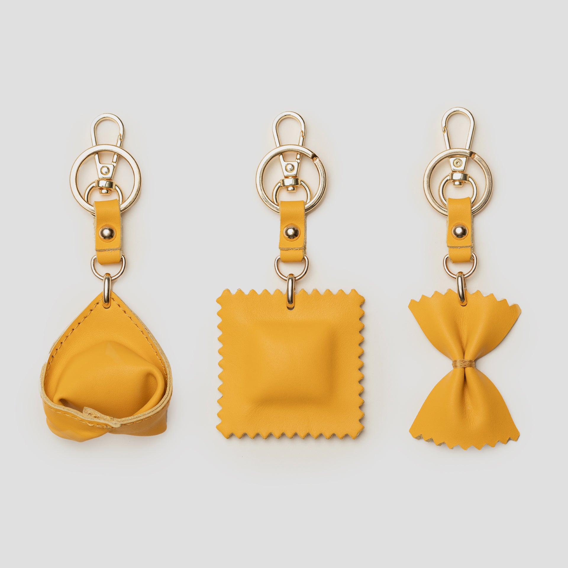 charm divertenti portachiavi in pelle a forma di pasta italiana tortellone raviolo farfalla brand ARRON made in italy idea regalo originale