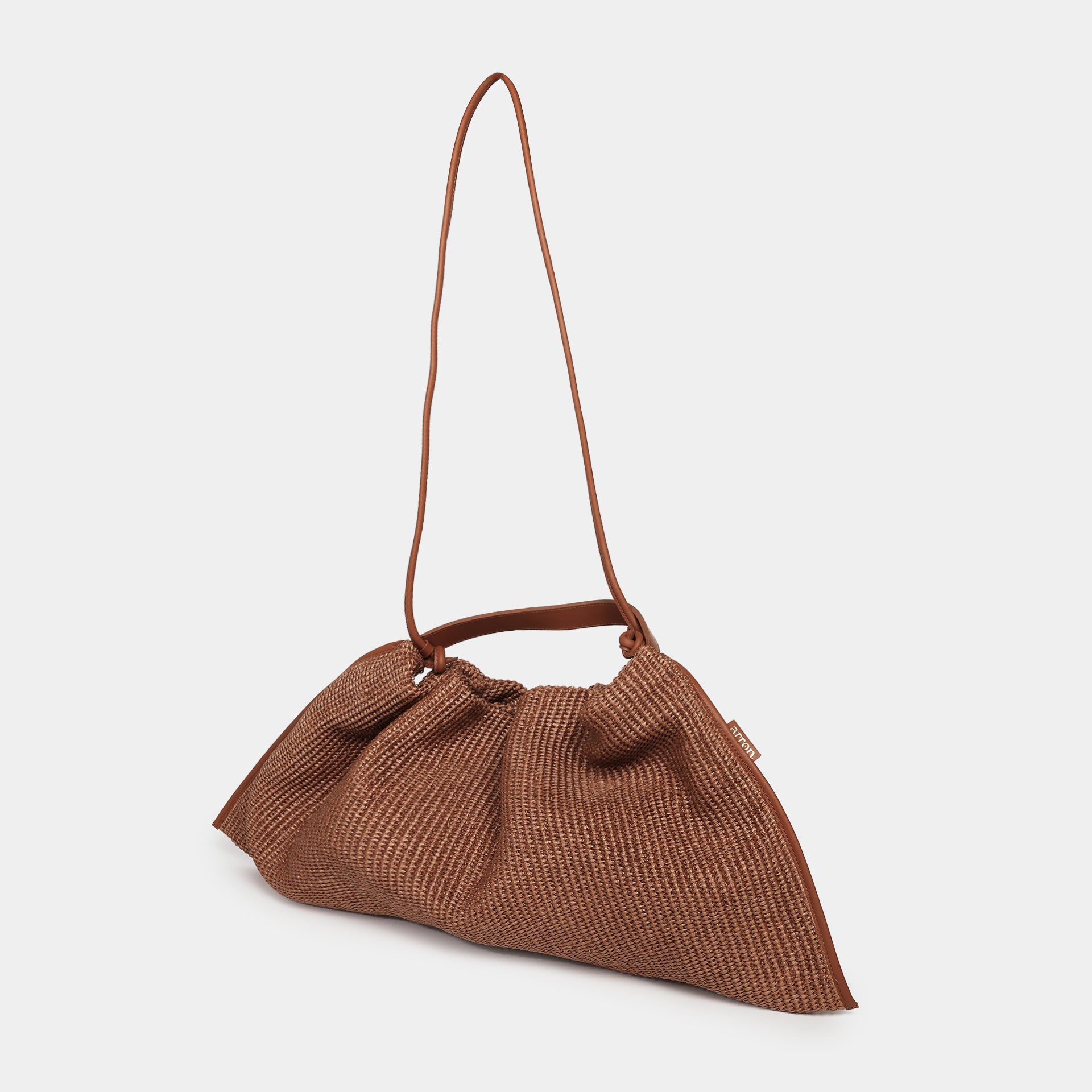 borsa destrutturata morbida in rafia e pelle marrone con manico e tracolla comoda brand Arron Made in Italy