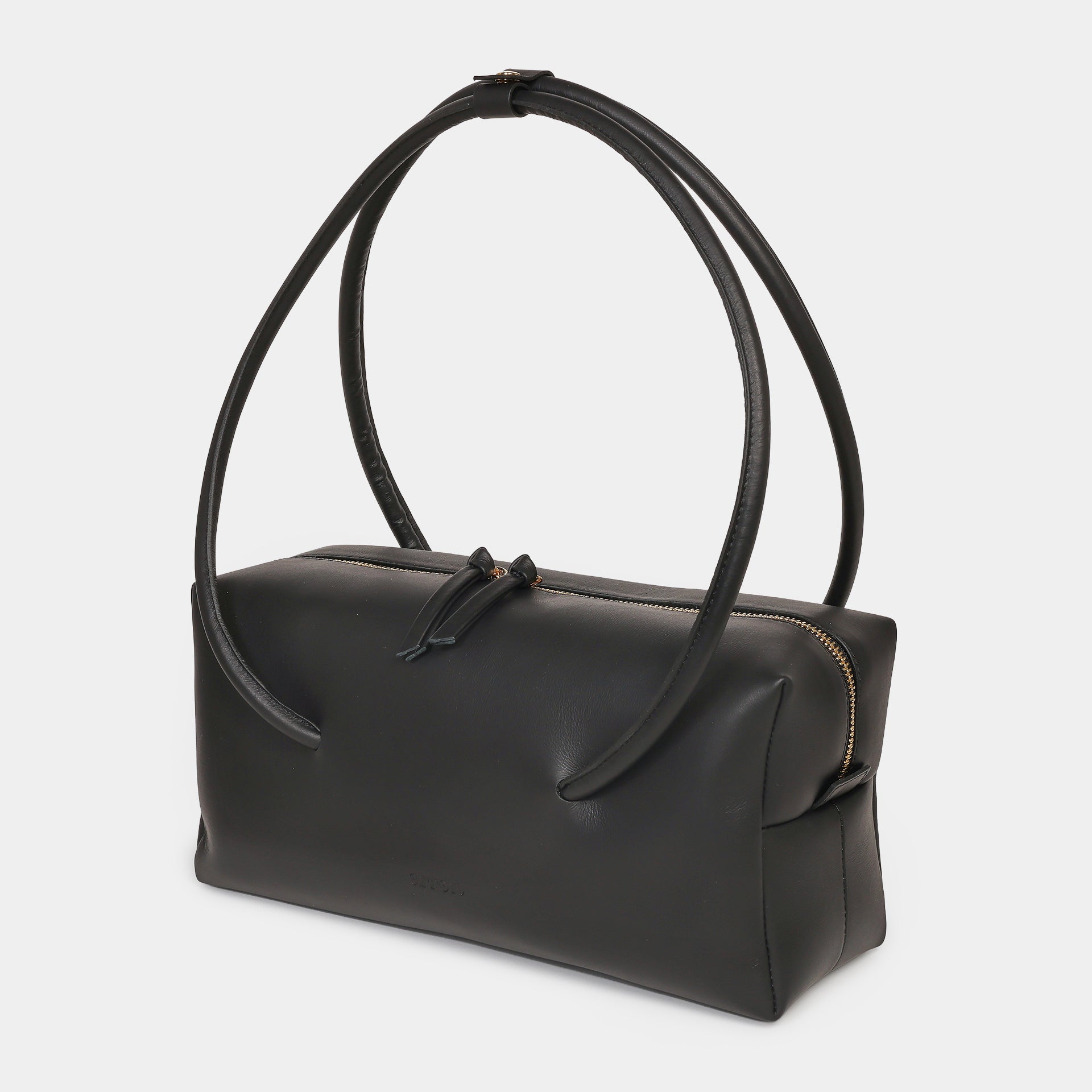 Carol borsa Made in Italy in pelle caramello scultorea grafica modello east west con manico di design brand Arron vista laterale