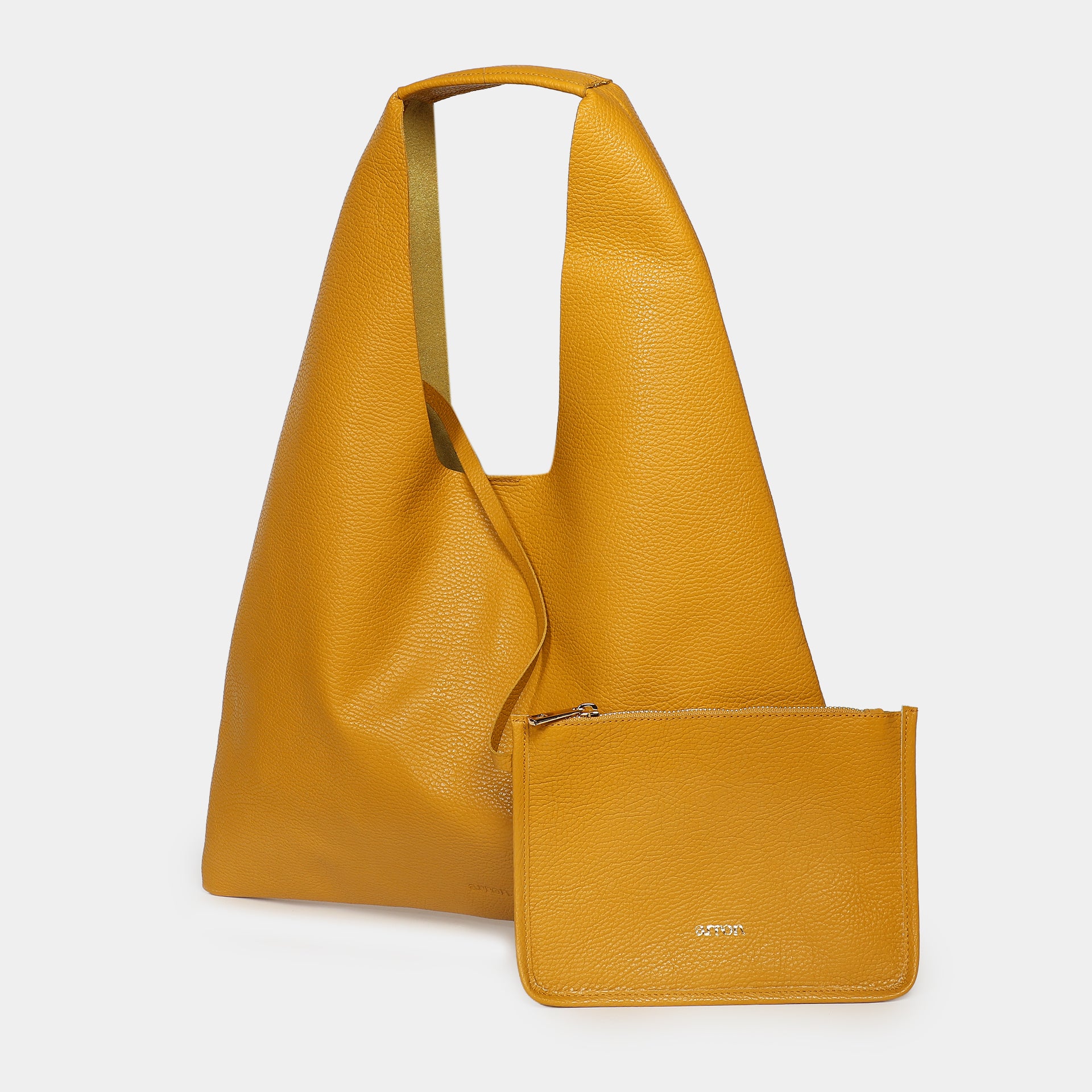 borsa Eva Arron in pelle martellata senape sfoderata vista laterale con taschino Made in Italy